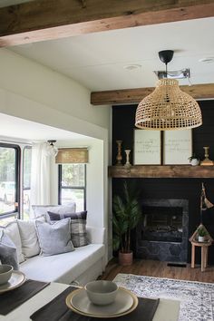 a living room filled with furniture and a fire place