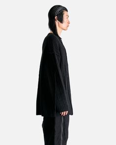 Yohji Yamamoto Pour Homme String Switching Round Neck in Black. This oversized sweater features vertical knit detailing, ribbed crewneck, cuffs, and hem, dropped shoulder seams, loose knit detail at the arm and rear and a straight hem. Oversized Black Cardigan With Ribbed Cuffs, Oversized Ribbed Sweatshirt For Layering, Oversized Ribbed Long Sleeve Sweater, Oversized Ribbed Crew Neck Cardigan, Oversized Sweater With Ribbed Neckline For Streetwear, Oversized Ribbed Knit Sweatshirt, Oversized Ribbed Crew Neck Outerwear, Jenny Bird, Clare V.