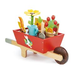 a wooden toy wagon filled with gardening items