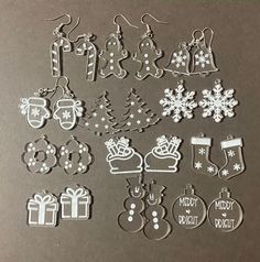 some christmas decorations and ornaments are on a metal surface with the words merry written in white