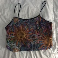 This Top Is Mesh And Cropped With Fun Little Designs All Over And It Also Has Never Been Warn Before And Even Still Has Tags!!! Open To Negotiating The Price So Feel Free To Message Size- Xs True To Size Hippie Shirts & Tops, Cheap Multicolor Tops From Urban Outfitters, Y2k Style Printed Tops For Summer, Y2k Style Cami Crop Top For Summer, Y2k Cami Crop Top For Summer, Y2k Sleeveless Crop Top For Vacation, Summer Graphic Print Cami Top, Graphic Print Cami Tops For Summer, Y2k Summer Vacation Tank Top