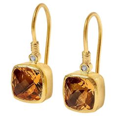 Faceted Checkerboard Citrine Earrings with Diamond Detail in 24kt Gold by Prehistoric Works of Istanbul, Turkey. Length: 22mm (.85"); Width: 8.8mm (.35"). Citrine is associated with positivity and optimism, which is not surprising given its cheerful color. It's often used to assist in manifesting financial abundance and opportunities. It can also be used to awaken the solar plexus chakra, helping to cultivate confidence and personal power. Financial Abundance, Citrine Earrings, Solar Plexus Chakra, Solar Plexus, 24kt Gold, Istanbul Turkey, Plexus Products, Citrine, Istanbul