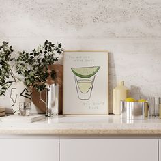 a kitchen counter topped with vases filled with plants