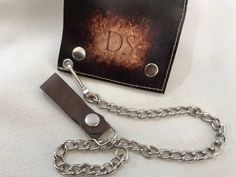 a wallet with a chain attached to it