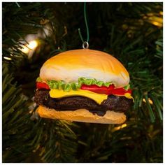 a hamburger ornament hanging from a christmas tree