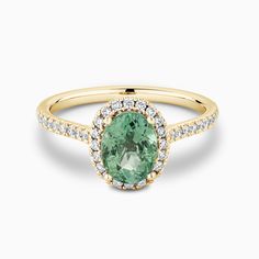 The Ecksand Diamond Halo Engagement Ring with Green Tourmaline shown with  in 18k Yellow Gold Light Green Engagement Ring, Green Diamond Engagement Ring, Printable Ring Size Chart, Green Engagement Rings, Ethical Diamonds, Diamond Halo Engagement Ring, Types Of Diamonds, Gemstone Engagement, Green Diamond