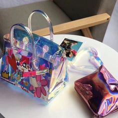 Medium Pink Floral Holographic Satchel Handbags Shoulder Clear Purse for $78.00 | Baginning Multicolor School Bag For Spring, Summer Party Purple Shoulder Bag, Playful Multicolor Spring Bags, Colorful Party Bags For Summer, Multicolor School Bag For Summer, Multicolor Summer School Bag, Multicolor Plastic Travel Bag, Multicolor Plastic Bags As Gift, Colorful Summer Bags For Gifts