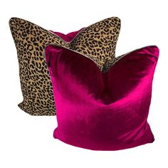 two pillows with leopard print on them, one in pink and the other in brown