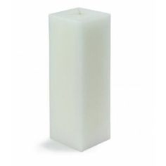 a white pillar candle on a white background