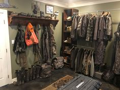 a room filled with lots of clothes and boots