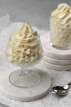 two dessert dishes with whipped cream on them