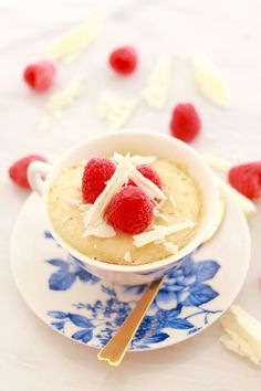 a bowl of pudding with raspberries on top