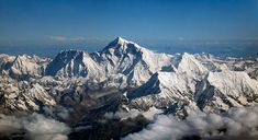 the mountains are covered in snow and clouds, with text reading speaking tree meta physical mountain