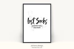 a black and white poster with the words lost socks looking for a sole mate on it