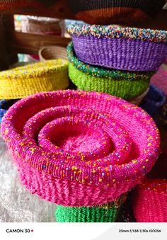 colorful baskets are stacked on top of each other