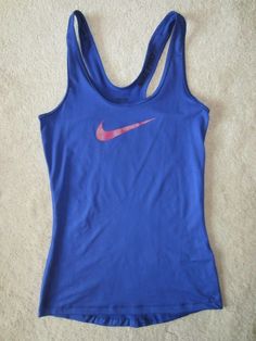 NIKE SPORTS TANK TOP THAT IS SLIMMING AND LOOKS GREAT ON. GREAT FIT AND STYLE. Functional Blue Cotton Activewear, Blue Cotton Go-dry Activewear, Nike Blue Cotton Activewear, Functional Blue Racerback Tops, Blue Cotton Training Tops, Blue Breathable Cotton Tops, Comfortable Blue Activewear For Gym, Casual Breathable Blue Tops, Casual Blue Breathable Tops