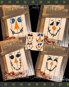 four wooden frames with faces painted on them