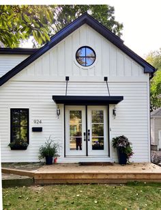 a white house with black trim and windows