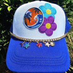 In This Listing Above: Unisex Trucker Hat Plus Add Ons: 3 Patches 1 Chain & 5 Charms Total W/Out Shipping & Fees: $45.00 Itemized Pricing Below _________________________________ Michikokoko's Hat Bar Hat + 1 Patch: $25 Hat + 2-3 Patches: $35 Hat + 4-6 Patches: $45 Hat + 7: $55 Accessory Add On Gold Safety Pins: $5 Each Pin Gold Safety Pin W/Beads: $7 Each Pin Chain/Plain: $6 Chain & 1 Charm: $8 Chain & 2-3 Charms: $10 Chain & 4-5 Charms: $15 Chain & 6-8 Charms: $25 Bead Strand: $15 _____________ Blue Adjustable Trucker Hat For Summer, Blue Adjustable Summer Trucker Hat, Trendy Blue Trucker Hat For Vacation, Adjustable Blue Trucker Hat For Summer, Summer Blue Adjustable Trucker Hat, Blue Trucker Hat For Vacation, Blue Snapback Trucker Hat For Festival, Summer Blue Snapback Trucker Hat, Blue Snapback Trucker Hat For Summer