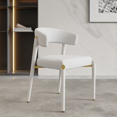 a white and gold chair in front of a book shelf