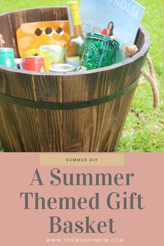 a wooden basket filled with lots of items on top of a grass covered field and text overlay that reads, a summer themed gift basket