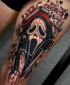 a man's leg with a tattoo on it that says what your favorite horror movie is