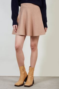 Shop For Beige Shaped Knit Mini Skirt At Glassworks London. Free Uk Shipping For Orders Over £75. Buy Now Pay Later With Klarna. | Fit: True To Size | Care: Gentle Wash Cold And Dry In Shade | Lining: None | Stretch: Low | Thickness: Moderate | Sheerness: None | Materials: 80% Acrylic, 20% Polyester | Measurements: 1. Waist: 30cm, 2. Length: 42cm Stretch Mini Skort For Fall, Chic A-line Winter Mini Skirt, Stretch Mini Length Skort For Fall, Fitted Knit Mini-length Bottoms, Fitted Knit Bottoms Of Mini Length, Stretch Mini Skirt With Lining For Fall, Fitted Knit Mini Length Bottoms, Stretch Lined Mini Skirt For Fall, Winter Stretch Mini Skort