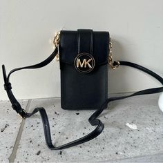 Nwt= Brand New With Tag Fast Shipping Smoke Free Enviro Pet Free Home Nwt Michael Kors Carmen Small Faux Leather Phone Crossbody Bag Crossbody Bag Faux Saffiano Leather 88.92% Coated Canvas/11.08% Polyester Trim: 100% Polyurethane Gold-Tone Hardware 4.25”W X 7”H X 1.25”D Interior Details: 3 Card Slots Lining: 100% Polyester Snap Fastening Imported Michael Kors Mobile Phone Bag, Michael Kors Crossbody Mobile Phone Bag, Michael Kors Mobile Phone Crossbody Bag, Michael Kors Crossbody Shoulder Bag With Cell Phone Pocket, Michael Kors Crossbody Bag With Cell Phone Pocket, Michael Kors Leather Shoulder Bag With Mobile Phone Holder, Michael Kors Crossbody Shoulder Bag With Mobile Phone Bag, Michael Kors Leather Shoulder Bag With Phone Holder, Michael Kors Shoulder Bag With Mobile Phone Bag