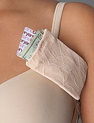 a woman wearing a bra with money sticking out of it's back breast pad