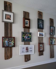 a wall with many frames and pictures on the wall next to it is decorated with wood planks