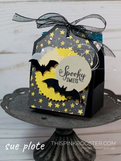 a halloween card with bats and stars on it