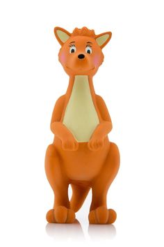 an orange plastic toy sitting on its hind legs