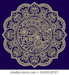 an ornate gold and blue background with paisley ornament in the center, on a dark