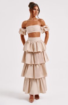 Cut from crisp, premium cotton, the Joy set is a vision. This super feminine, pretty skirt is maxi length with layers of ruffles and a cinched high waist. 



Colour: Beige.

Premium cotton fabric.

Cinched high waist.

Ruffle detail.

Maxi length.

Model is an XS and is wearing an XS.

 Size: XS, S, M, L, XL, XXL Homecoming Dresses Corset, White Dress Spring, Midi Dress Wedding Guest, Pretty Skirt, Long Sleeve Homecoming Dresses, Split Long Dress, Pretty Skirts, Homecoming Dresses Long, Maxi Dress Sale