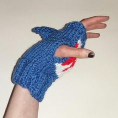 Knitting pattern for handmade chunky knit blue shark mittens/fingerless gloves with mouth detail and shark finMade with 6mm needles to fit both male and female adults. Mittens measure approximately 7 inches long and 4 inches wide when finishedEasy read chartI have also used the same pattern with 4mm or 4.5mm needles and dk yarn to knit these gloves for children Knitted Shark Pattern Free, Sharkcore Outfits, Shark Mittens Crochet Pattern, Kawaii Shark Clothes, Shark Beanie Crochet, Shark Scarf, Knitted Shark Socks, Shark Clothing, Shark Knife