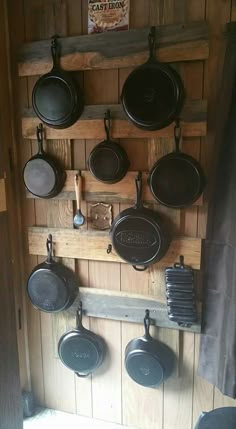 pots and pans are hanging on the wall