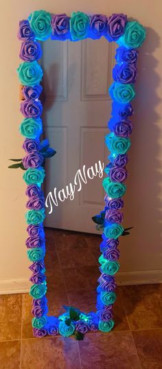 a blue and purple frame with roses on it