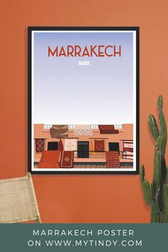 a poster hanging on the wall next to a cactus