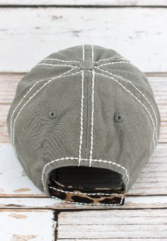 This cap is the perfectyear-round fashion accessory! 100% Cotton Distressed Cap Embroidered Leopard Print Applique and Message Leopard Print on Underside of Brim and on Closure Contrast Stitching 6 Panel Sewn Eyelets and Button Top Velcro Closure Pre-Curved Visor Washed Details for Vintage Look Adjustable, One Size Fits Most Casual Snapback Hat With Wide Brim For Outdoor, Casual Wide Brim Snapback Hat For Outdoor, Gray Curved Brim Hat For Camping, Rustic Outdoor Cap, Casual Curved Brim Snapback Hat For Country Events, Gray Cap For Camping, Gray Adjustable Hat For Camping, Adjustable Gray Hat For Camping, Casual Gray Hat For Camping