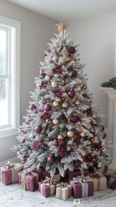 a decorated christmas tree with presents under it