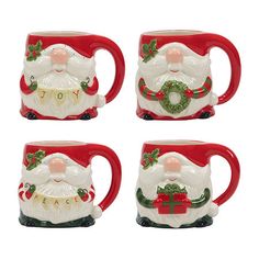 four christmas mugs with santa clause on them