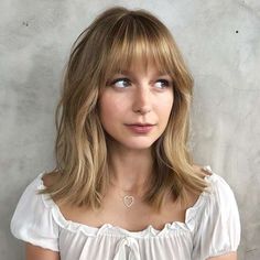 Full Fringe Cute Modern Haircuts, Wispy Textured Bangs, Thick Bangs Round Face, Medium Hair With Bangs And Glasses, Medium Length Bangs Fringes, Long Bob Bangs Round Face, Short Hair With Fringe Bangs Round Faces, Eyebrow Length Bangs, Medium Length Haircut With Fringe