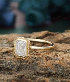 a close up of a ring on a rock