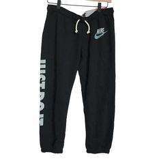 Banded Fold Over Logo Waistband Drawstring Nike Black Cuffed Joggers That Feature An Ombr White And Greenish Blue Nike Swoosh Symbol Near The Hip And Say Just Do It Written Down The Leg And On Waistband Sweats Are Regular Fit And Slim At Hip, Relaxed Through Leg. Material Composition: 80% Cotton 20% Polyester Circa 2013 Rare Discontinued Style New With Tags And Pants Never Have Been Worn Us Women’s Size Small Workout Pants Nike Bottoms With Letter Print For Streetwear, Nike Casual Bottoms With Letter Print, Nike Streetwear Bottoms With Letter Print, Casual Nike Bottoms With Letter Print, Nike Black Bottoms With Letter Print, Nike Sporty Bottoms With Letter Print, Nike Tech Suit, Drawstring Nike, Nike Womens Sweatpants