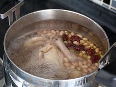 a pot filled with beans on top of a stove