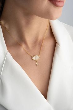 925 Sterling Silver Cloud and Lightning Necklace, Gold-Plated, Dainty Cloud Necklace, Minimalist Lightning Bolt Pendant, Layering Necklace, Birthday Gift, Loving Necklace, Gift for Her ⋆｡ ﾟ☁︎｡ ⋆｡ ﾟ☀︎｡ ⋆｡ ﾟ This 925 sterling silver cloud and lightning necklace, with its gold-plated finish, is both delicate and bold. The smooth cloud pendant contrasts beautifully with the sharp lightning bolt hanging below. Its simple yet striking design makes it perfect for layering or wearing as a standout piece Lightning Necklace, Cloud Necklace, Cloud Pendant, Rain Cloud, Silver Cloud, Rain Clouds, Necklace Minimalist, Layering Necklace, Lightning Bolt