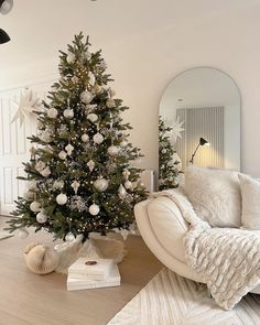 a living room with a christmas tree in the corner