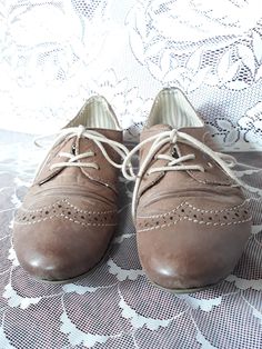 "Cappuccino brown leather women`s wingtip lace up flat heels shoes. Leather sneakers. Decorative perforated and wrinkled front. Size 36 EU. brand: Rieker (Germany shoemaker company) condition: has some slight signs of wear. Look at the photos. Heels height 0.6\" in / 1,5 cm Outsole length- 10.3\" in / 26,5 cm bottom sole width in widest place 3\" in / 7,8 cm SIZE: labeled 36 EU size; Estimated is 36 EU. US 5.5." Brown Lace-up Shoes With Brogue Detailing, Brown Almond Toe Lace-up Shoes With Brogue Detailing, Brown Wingtip Lace-up Oxford Shoes, Brown Wingtip Oxfords With Laces, Brown Leather Wingtip Shoes With Laces, Brown Wingtip Leather Shoes With Laces, Classic Brown Lace-up Shoes With Low Heel, Brown Leather Almond Toe Shoes With Laces, Brown Low Heel Lace-up Shoes Casual