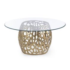 a glass and metal table with an intricate design on the top, against a white background