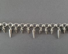 "Show your alternative side with this silver spike charm bracelet. It is subtle enough to wear to work or pair it with a little black dress for a night out on the town! 💀 DESCRIPTION: This silver link bracelet features two different lengths of metal spikes. The bracelet was finished with a lobster clasp. This bracelet can also be made with only small spike charms. Choose the style from the drop down menu. 💀 SIZE & MATERIALS: The small silver spikes measure 1/2\" long and the medium spikes Jewelry Goth, Crow Skull, Metal Skull, Metal Spikes, Industrial Jewelry, Silver Link Bracelet, Gothic Accessories, Girlfriend Birthday, Birthday Gifts For Girlfriend